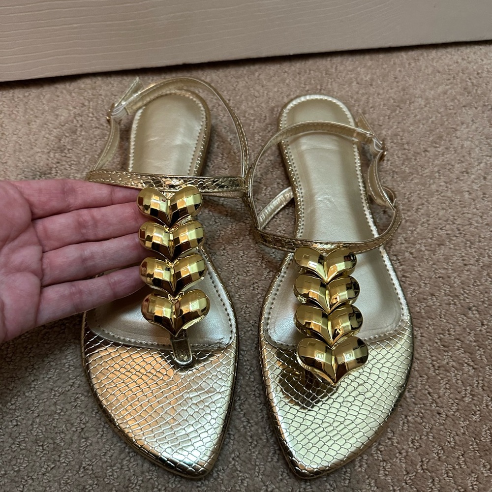 New gold sandals with heart detail on front